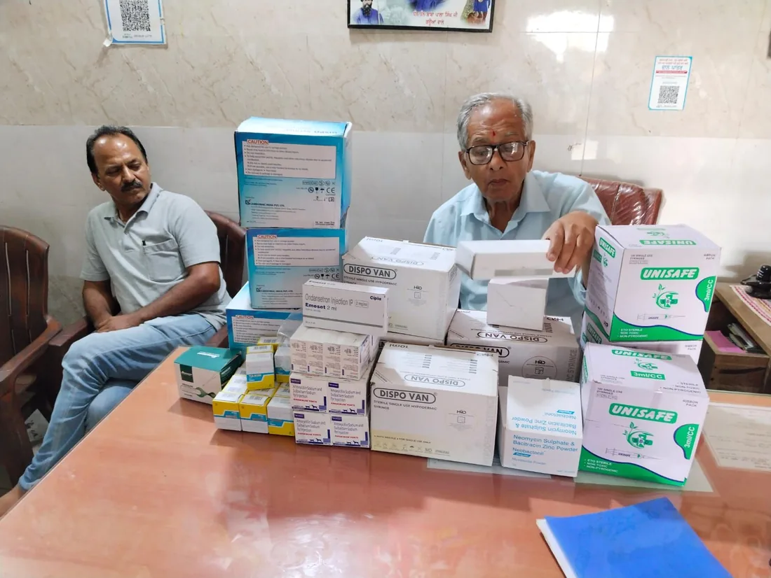 Volunteers organising veterinary medicines and supplies for the animal hospital.